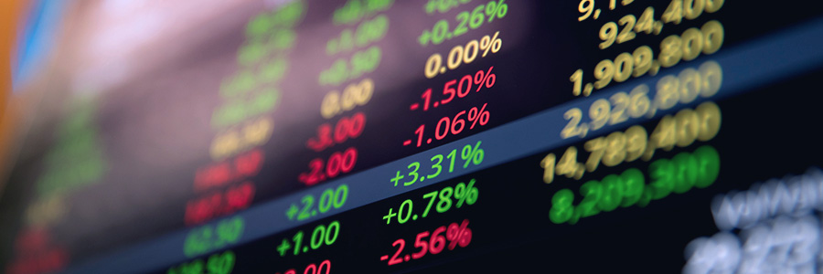 Digital stock market numbers on a screen.