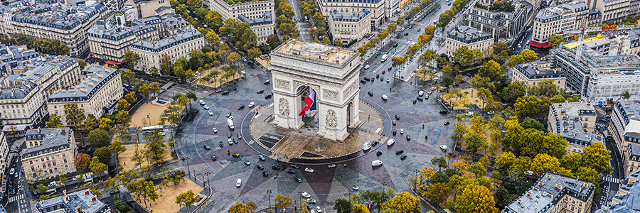 Aerial view of the Arc de Triomphe and surrounding streets in Paris, France.
