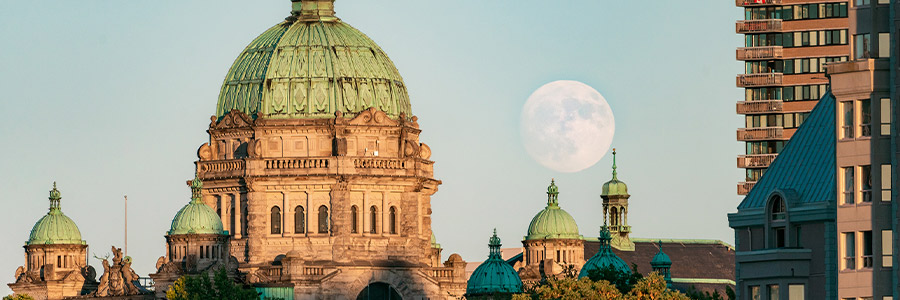 Full moon behind the British Columbia Parliament Buildings in Victoria.