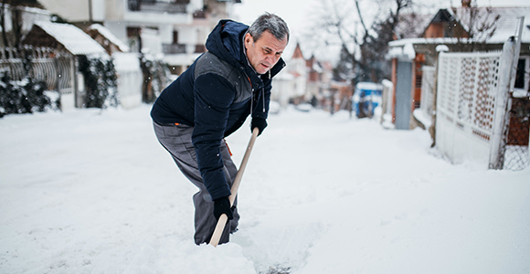 Image of a man shoveling snow