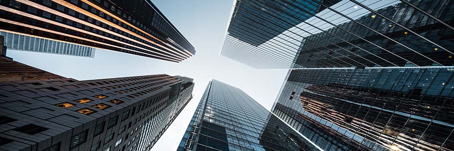 Looking upwards at office buildings.