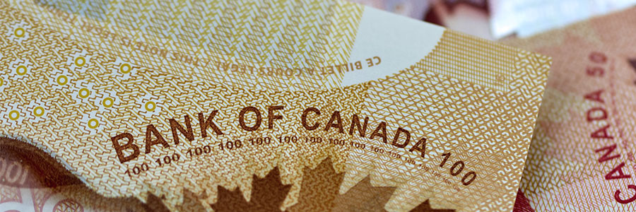 Macro closeup of Canadian 100-dollar and 50-dollar bills.