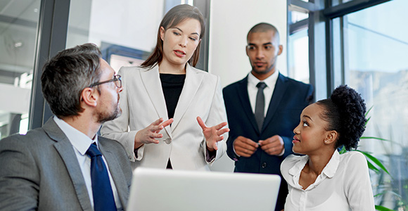 A professional leading a meeting in a conference room.