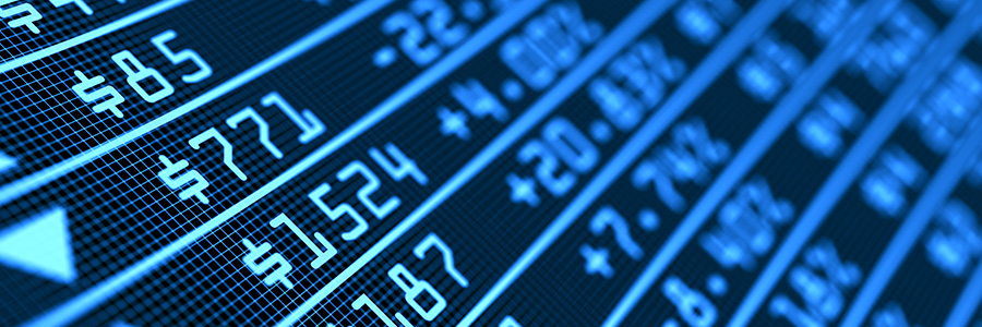 Macro close up image of a digital stock market board showing blue numbers and prices.