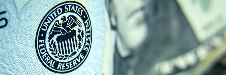 Closeup of a US Federal Reserve System stamp on a US note.