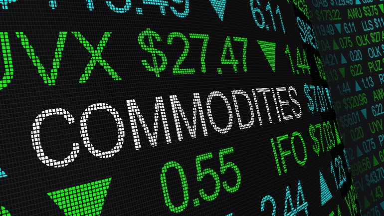 Close up of a digital display showing the word “Commodities” among financial market prices.