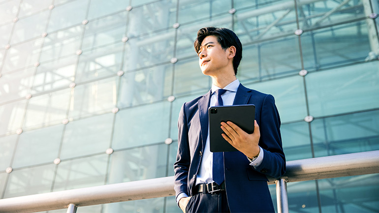 Business person holding a tablet computer