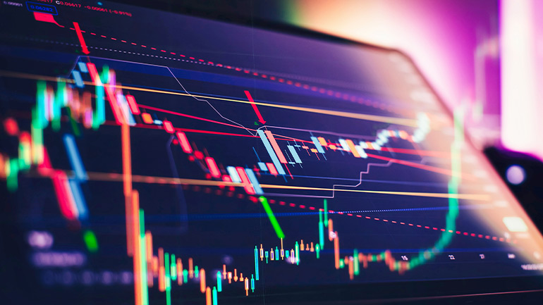 Digital stock price chart with candlesticks and trend lines.