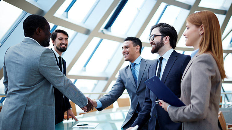 People in suits shaking hands