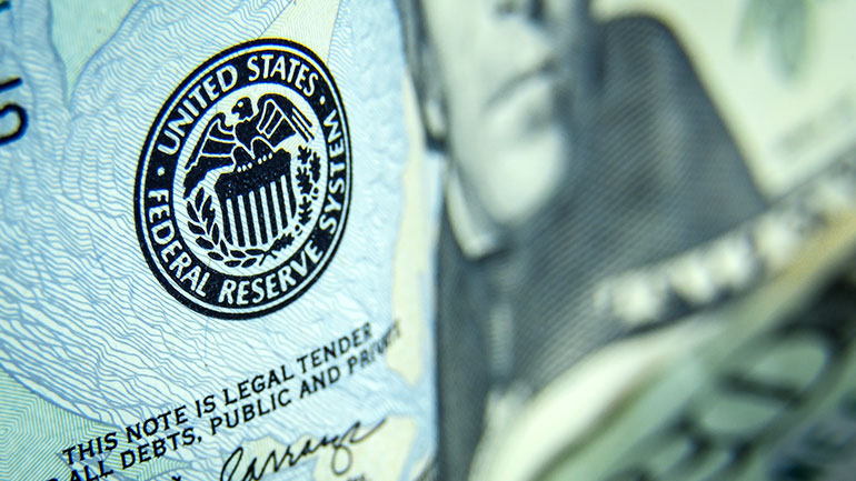 Closeup of a US Federal Reserve System stamp on a US note.