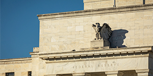 Federal Reserve building with eagle sculpture.