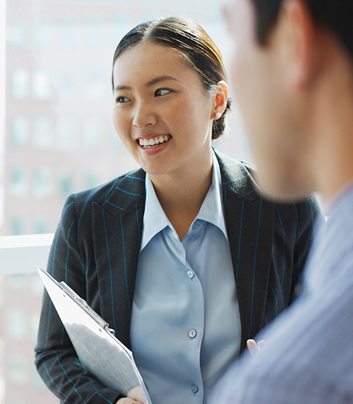 Employees discussing client business.