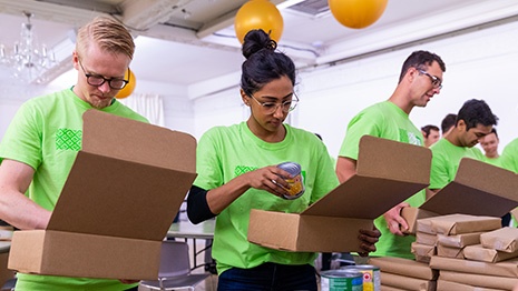 People filling boxes for donation